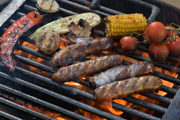 juicy meat sausages fried over an open fire