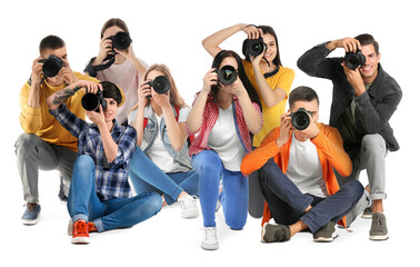 Group of professional photographers with cameras on white background