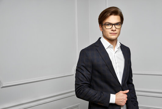 Handsome Young Man Wear Tailored Suit In Checked Pattern