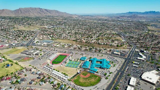 Franklin High School in West El Paso, Texas with Franklin Mountains in the Background. Drone Aerial View.