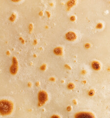 Pan fried pancake as a background.
