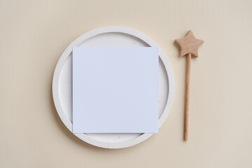 Square mock up card on white terrazzo plate, magic stick concept on beige background 