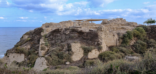 Apollonia Crusader Castle, the castle south face fortification remains, located on a high kurkar sandstone cliff facing the Mediterranean seashore of Herzliya city, Apollonia National Park, Israel.