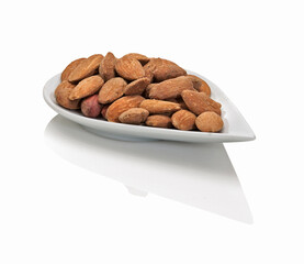 almonds in a small plate - 501360376