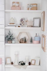 Wall shelves with beautiful Christmas decor indoors. Interior design