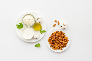 Almond products - milk oil and flour with seeds, top view