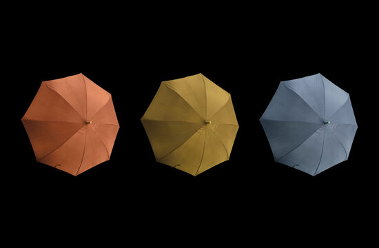 Top view, Set three colours umbrella isolated on black background, stock photo, invesment, business, summer concept, orange gold pastel blue violet colors