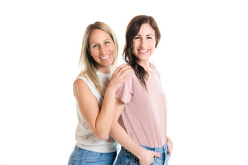 Two smiling best girl friends blond and brunette on white background. Closeup face portrait of two...