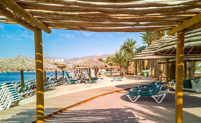 Concept of blessing and happy vacation. Relaxing public beach resort on the Red Sea, Middle East 