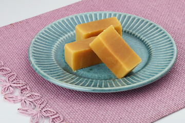 Mysore pak is an Indian sweet made of gram flour prepared in ghee. It is originated in the city of Mysore