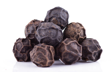 Black pepper isolated on a white background close up