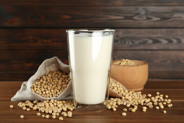 Fresh soy milk and beans on wooden table