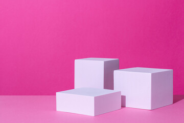 Empty podium or stand for product showcase on pink background