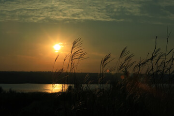 Picturesque view of beautiful cloudy sky over river at sunrise