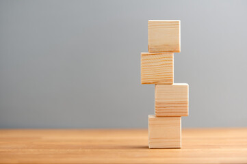 Blank wooden block cubes on a gray background for your text and advertisement. Free space for business concept template and banner..