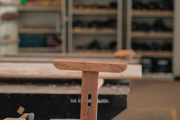 Senior male woodworker making console table  in workshop. Joinery work on the production  of wooden furniture. Small Business Concept