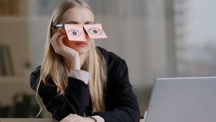 Tired sleepy caucasian woman with adhesive notes on eyes sticky notes on glasses. Lazy exhausted...