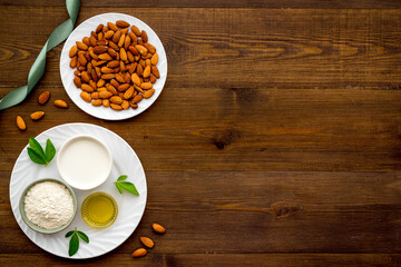 Almond products - milk oil and flour with seeds, top view
