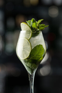 Mojito in a glass. Photo of drinks on a dark background