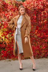 The girl is a model showing fashionable clothes on the street. Summer, the girl's back is a living fence. Showroom