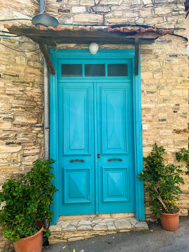 Old blue wooden door with glasses. Details Classic vintage door