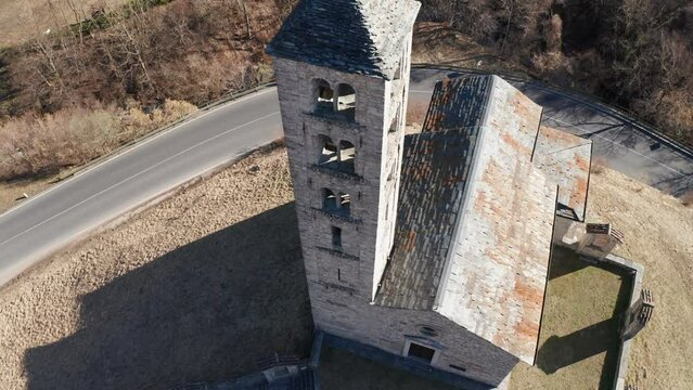 Aerial view of the small ancient church of St. Alexander, an example of the widespread Romanesque rural architecture of XII century in the Como area (Italy).