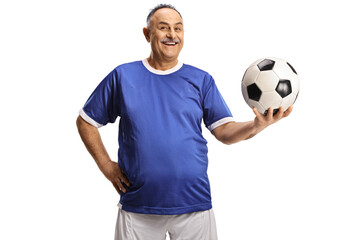 Cheerful mature man in a football jersey holding a ball and smiling