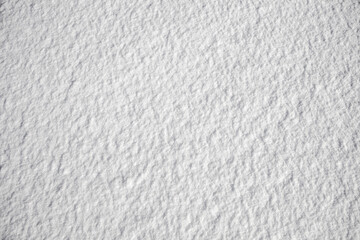 Snow white background top view, snow cover on clear bright day.