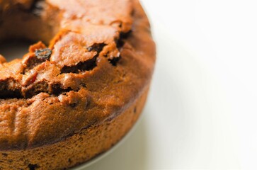 Freshly made spiced fruit ring loaf cake  on the white  background