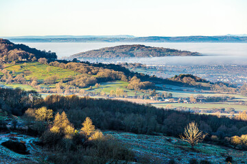 A temperature inversion causing fog to obscure the Vale of Gloucester, England UK. Robinswood Hill...