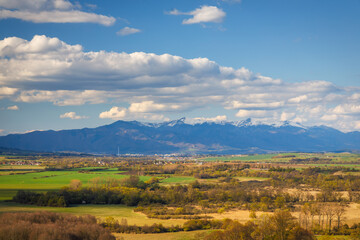 Fototapeta premium Sunny spring rural landscape, the valley with mountains in the background. Turiec Valley in Slovakia, Europe.