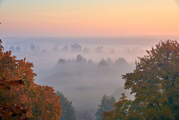 Naklejka na ściany i meble morning fog over the valley at the sunsrise in Ukraine
