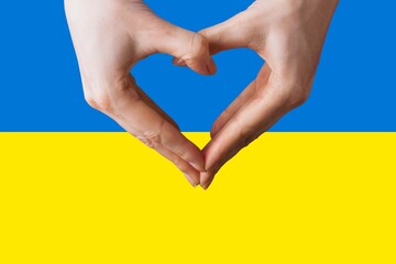 Obraz premium The concept love of the Ukraine. Heart in female hands.
