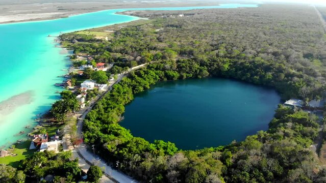Aerial Drone Shot of Beautiful Cenote Azul and view on 7 seven colors lagoon in Bacalar, Quintana Roo, Mexico