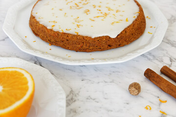 Vegan tofu and carrot cake with orange zest and orange juice and sugar frosting. Homemade vegan dessert.