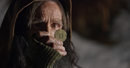 Homeless beggar pick up bitcoin and frown face expression. Useless coin concept.