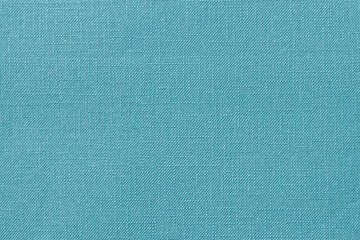 Textured teal color paper background. Close-up of decorative sheet of paper.