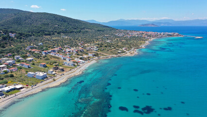 Aerial drone photo of small picturesque village beach and port of Megalochori in island of Agistri, Saronic gulf, Greece
