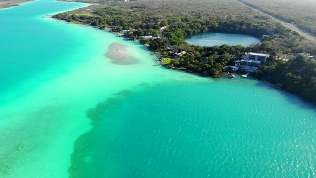 Aerial Drone Shot of Beautiful Cenote Azul and view on 7 seven colors lagoon in Bacalar, Quintana Roo, Mexico