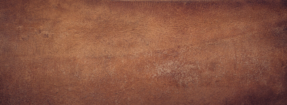 Dark brown cracked leather texture background