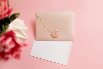 Photography from above of gift certificate.Tender pink color,springtime holidays.