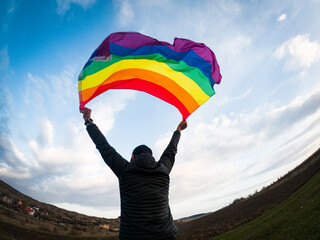 gay flag against blue sky lgbt and pride