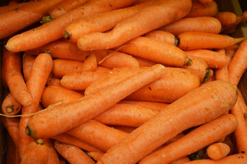 Fresh orange carrots on the store counter. Background. Vegetables, harvest.