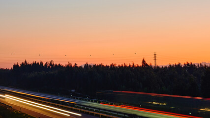 Blurry illuminated highway at the golden hour