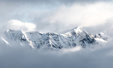 Magnificent view of Nordkette in white clouds, Austria, Tirol, Innsbruck - obrazy, fototapety, plakaty