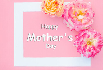Lettering Happy Mother's Day with delicate multi-colored roses on a pink background