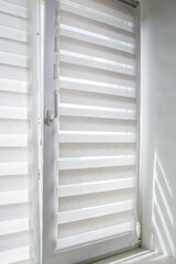 Obraz premium Window roller duo system day and night. Close up on roll curtains indoor.