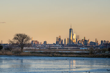 Naklejka na ściany i meble NYC towers taken from NJ park during sunset, perfect end of the day, skyline theme.
