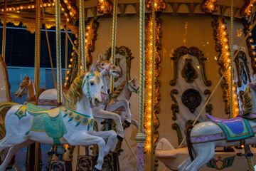 Fototapeta na wymiar Carousel for kids with lights on in Barcelona