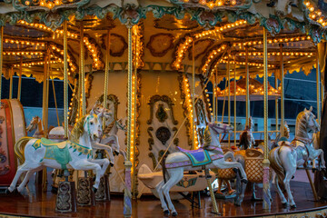 Carousel for kids with lights on in Barcelona